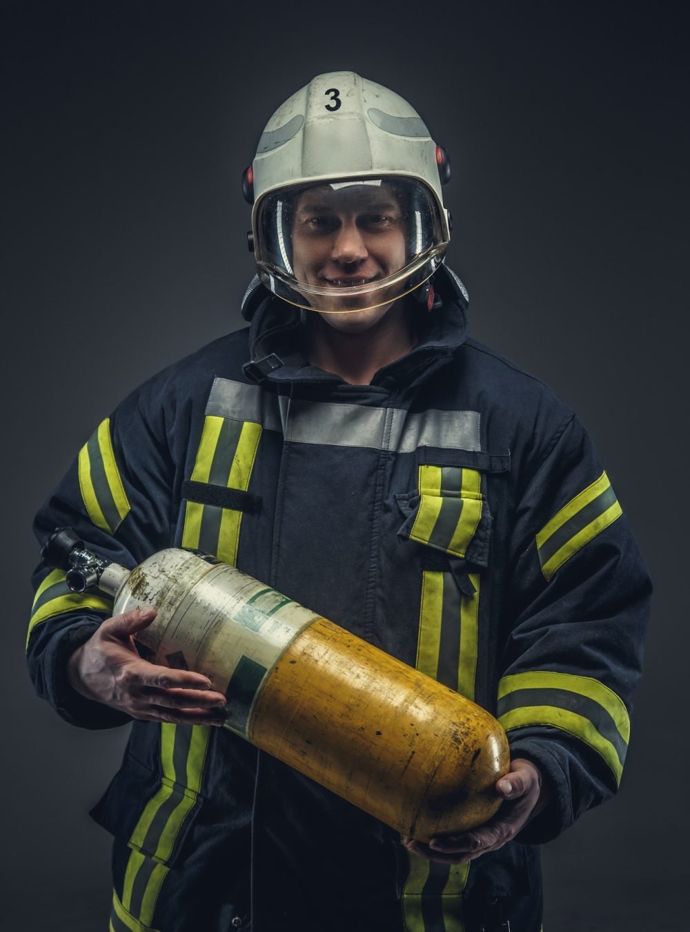 firefighter-rescue-holds-yellow-oxygen-tank-.jpg firefighter-rescue-holds-yellow-oxygen-tank-.jpg